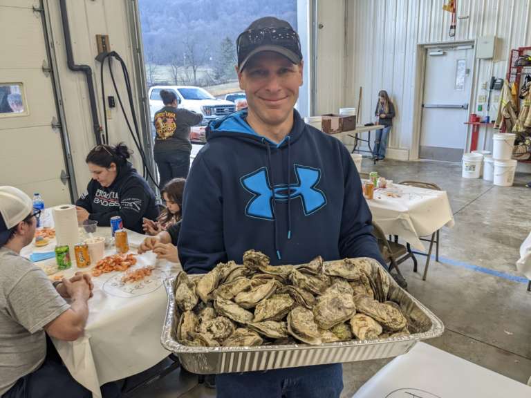 Jamie Rogers carries a tray full of Oysters!